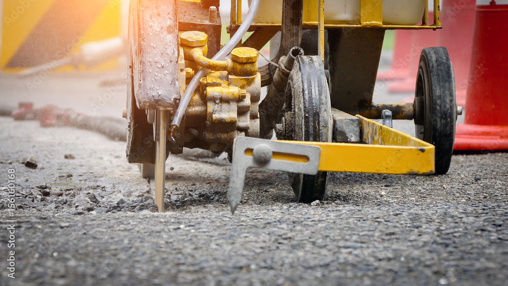 Fotografie Road construction with an asphalt cutter
