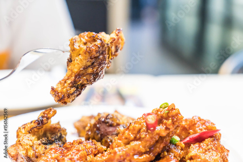 fried chicken with spicy sauce photo