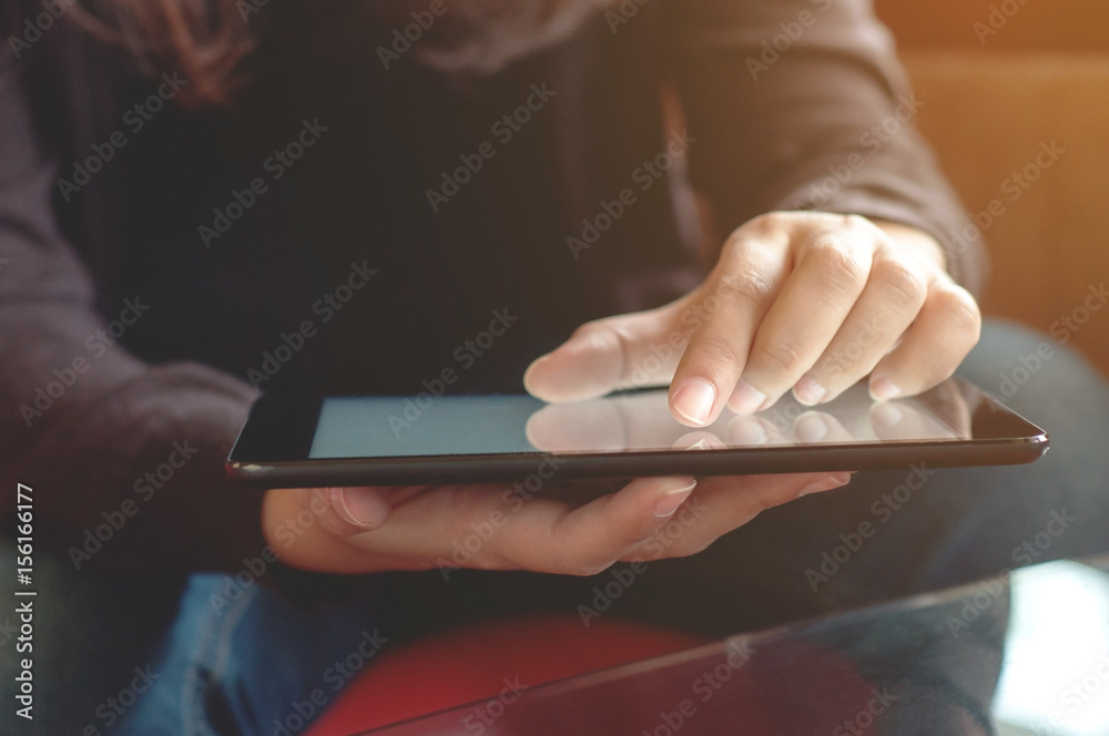 close up young woman using tablet at a cafe close up young woman using tablet at a cafe