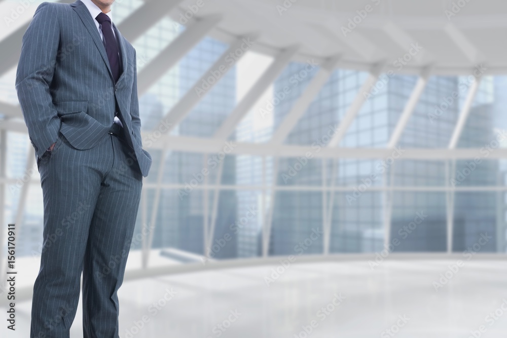 Part of businessman standing on in empty building Part of businessman standing on in empty building