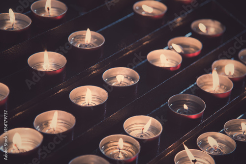 Candles lit in a church. photo