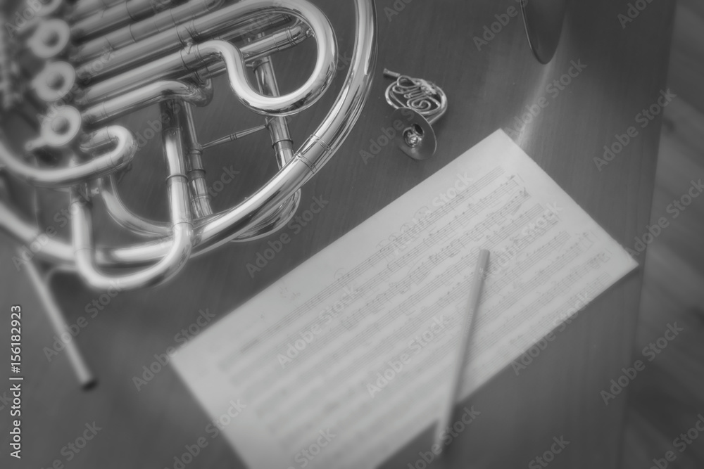 figurine of a french horn and french horn musical instrument Stock