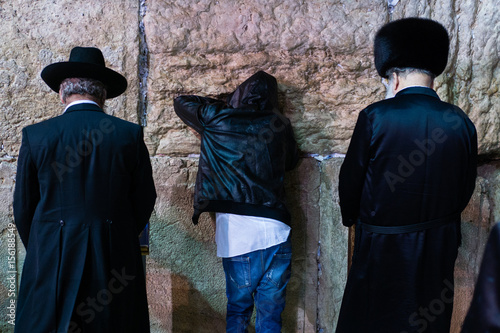 Three different selichot prayers at the wailing wall, the Kotel, at Jerusalem photo