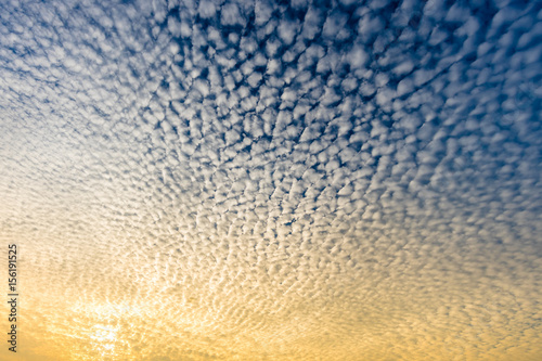 Cloudscape with altocumulus clouds, Altocumulus middle-altitude cloud in stratocumuliform - natural background photo