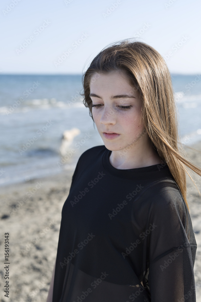 Teenage girl posing on the beach. Shot taken in Santa Pola in the province of Alicante, Spain. Teenage girl posing on the beach. Shot taken in Santa Pola in the province of Alicante, Spain.