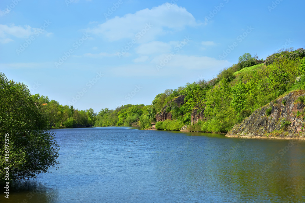 flow of a wide river with picturesque shores and interesting details flow of a wide river with picturesque shores and interesting details