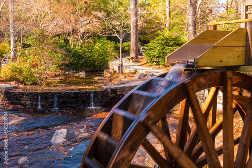 A stream of water falling on the water wheel of the Grist Mill in the Stone Mountain Park, Georgia, USA