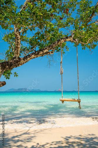 Fototapeta Naklejka Na Ścianę i Meble -  swing hang on big tree over beach sea