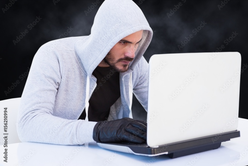 Cyber criminal is hacking from a laptop Cyber criminal is hacking from a laptop