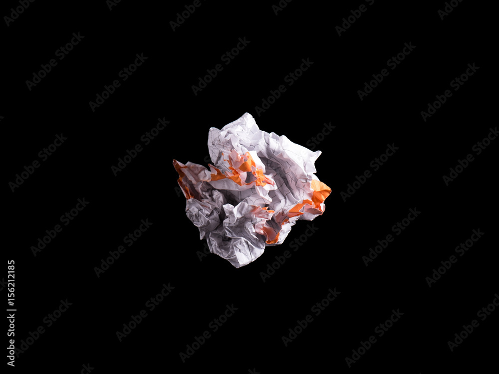 Crumpled piece of white blank squared paper exercise book on black background. Crumpled piece of white blank squared paper exercise book on black background.