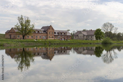 Old buildings are displayed in a pond in Minsk