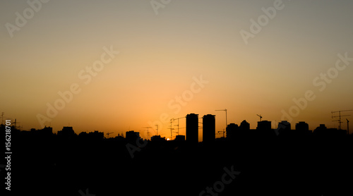 Silhouette of the skyline of town at sunset - Petach Tikva, Israel © MTGati