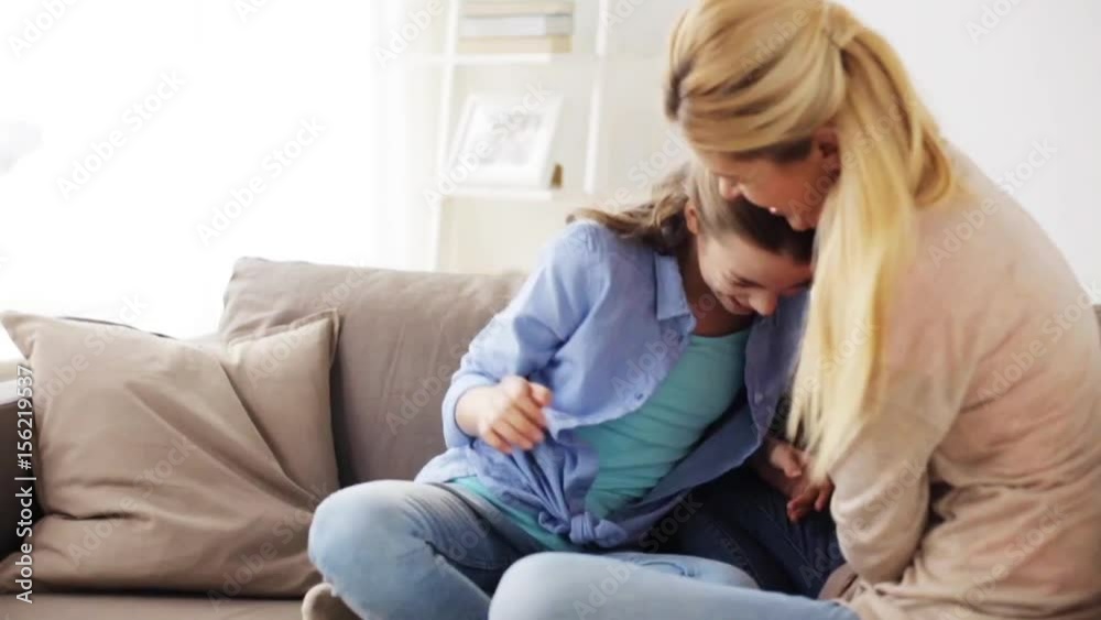 happy family having fun and tickling at home happy family having fun and tickling at home