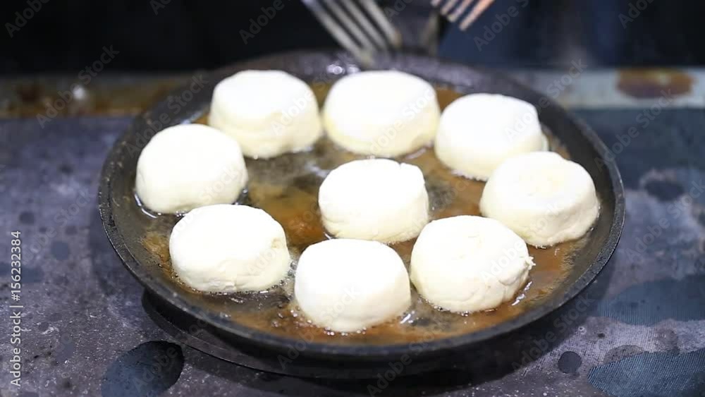 cheesecakes round shape fried in a cast iron skillet cheesecakes round shape fried in a cast iron skillet