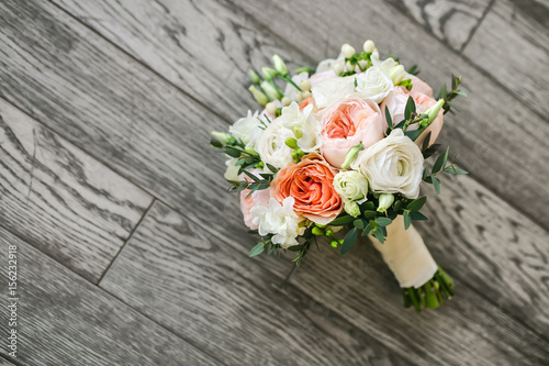 Bridal bouquet on the wooden floor