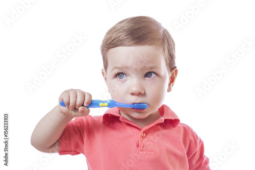 Cute baby boy brushing teeth