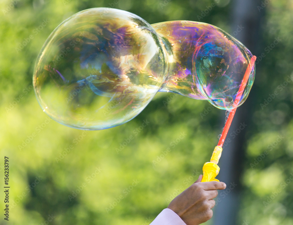 Beautiful soap bubbles fly in the city Beautiful soap bubbles fly in the city