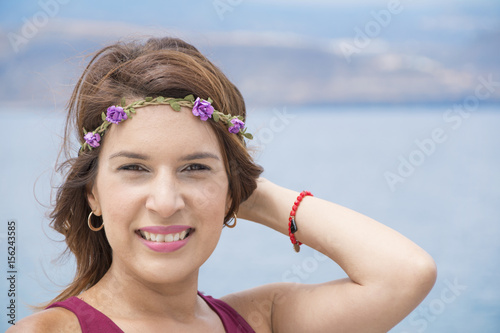 Happy woman with wreath on her head.