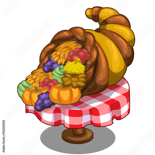 Cornucopia with fruits and vegetables on the table