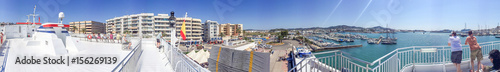 IBIZA, SPAIN - JUNE 2015: Tourists walk in the city port, panoramic view. Ibiza is a famous tourist destination in Spain