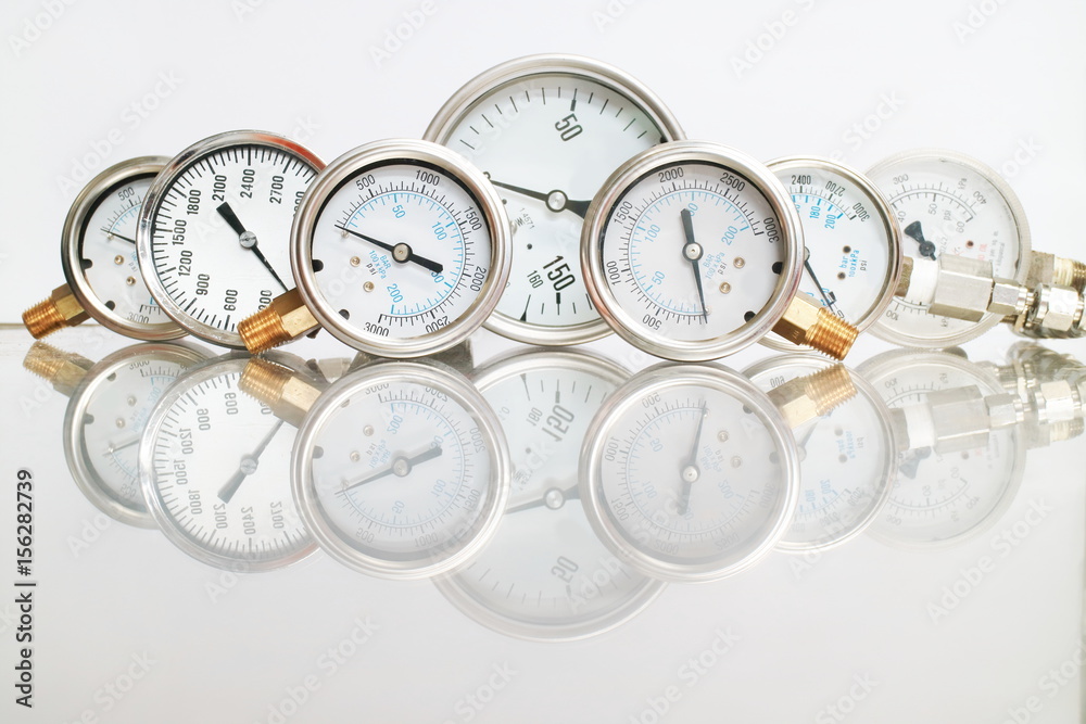 High pressure gauge meters or manometers for LNG or LPG natural gas distribution station plant or factory facility isolated on white background.Pressure gauge in oil and gas production process.