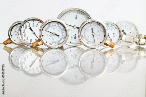 High pressure gauge meters or manometers for LNG or LPG natural gas distribution station plant or factory facility isolated on white background.Pressure gauge in oil and gas production process.