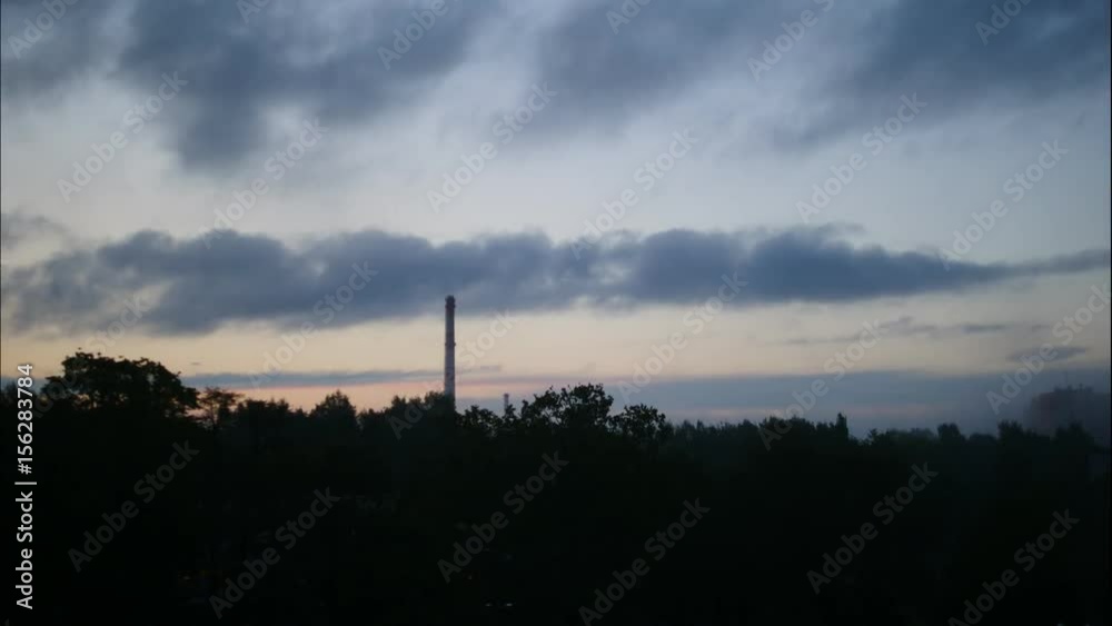 Sunset Time Lapse Sky and moving clouds Power Plant pipe with smoke Latvia 4K Sunset Time Lapse Sky and moving clouds Power Plant pipe with smoke Latvia 4K