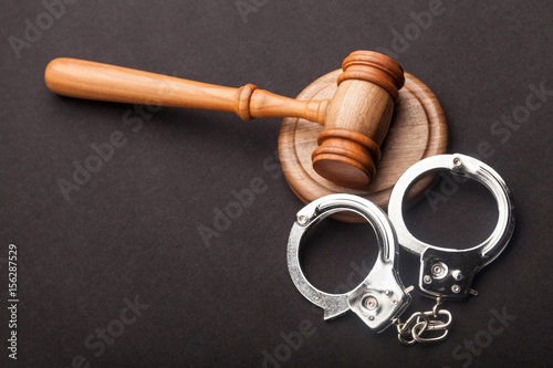Gavel and handcuffs.