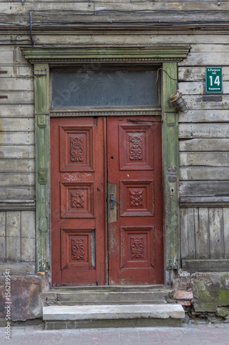 Old wooden colored double doors. © Eric