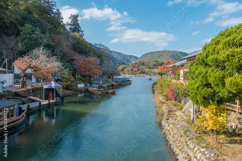 Boats over Nishiki river in Iwakuni, Yamaguchi prefecture, Beautiful valley with seasonal colorful trees and blue sky landscape in Japan.