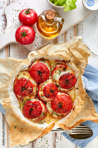 Baked tomatoes stuffed with spinach, cheese and herbs, top view