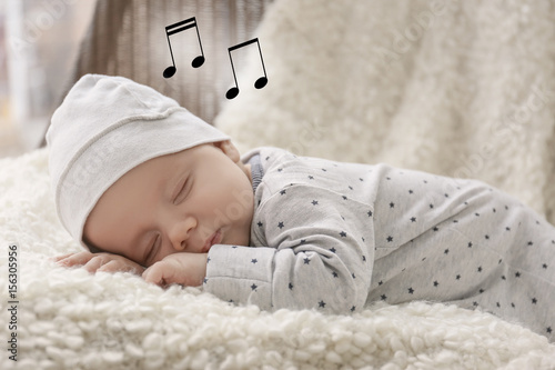 Canvas Print Cute little baby sleeping on plaid at home