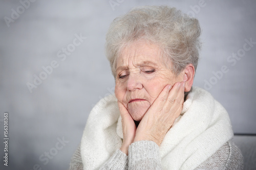 Senior ill woman with sore ...