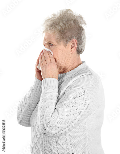 Mature ill woman with tissu...