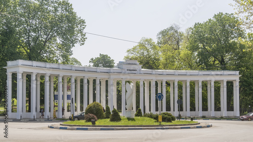 The architecture with white columns at the entrance to the city park Parcul Nicolae Romanescu, Craiova, Romania photo