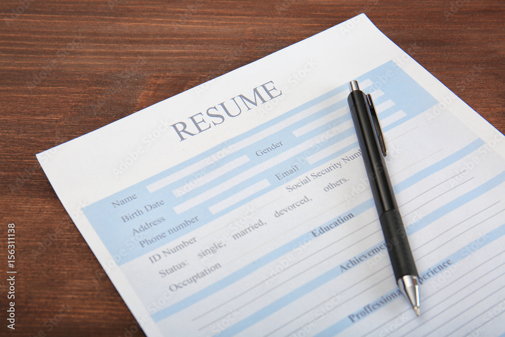Resume form with pen on table Resume form with pen on table