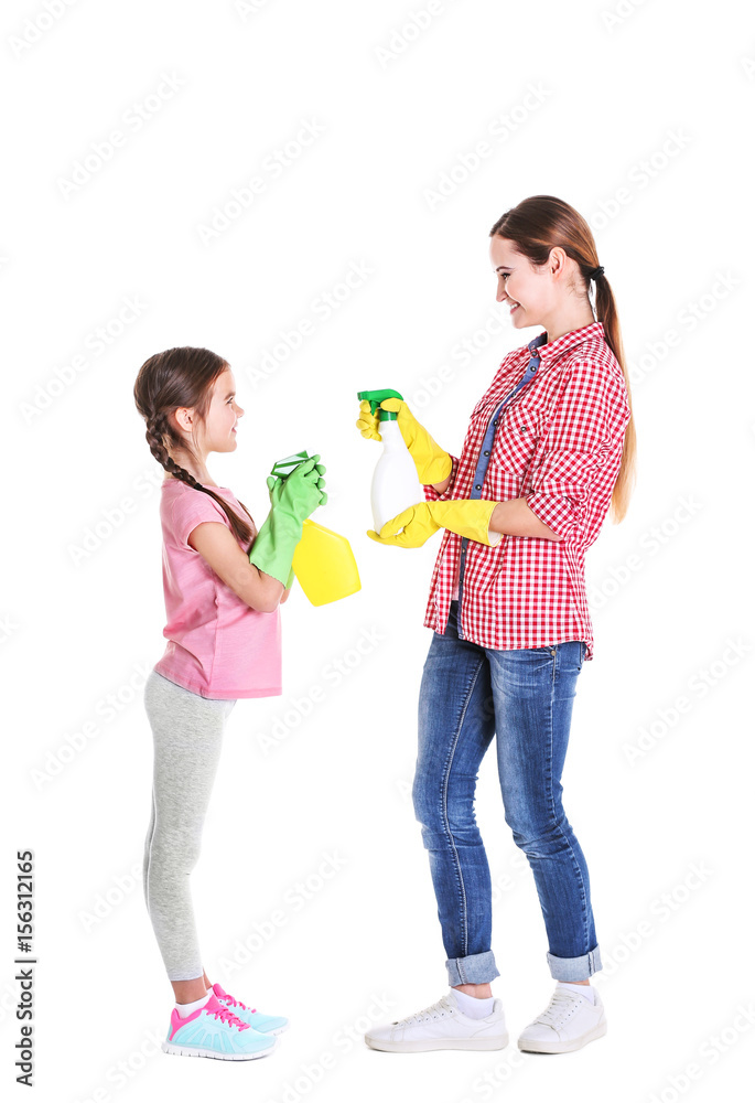 Mother and daughter with two bottles of detergent, isolated on white Mother and daughter with two bottles of detergent, isolated on white