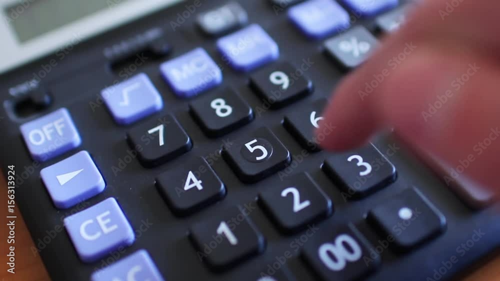 Counting on calculator. Finger presses the button calculator. Closeup. Counting on calculator. Finger presses the button calculator. Closeup.