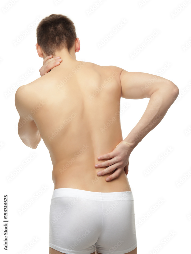 Young man suffering from back pain on white background Young man suffering from back pain on white background