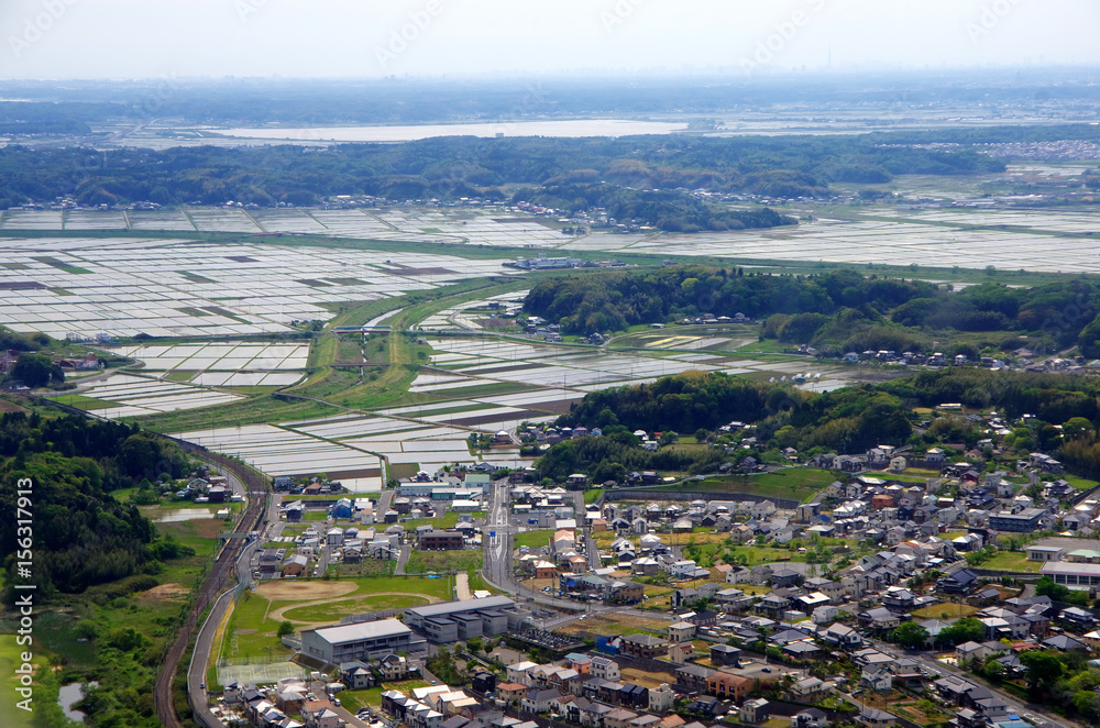 Aerial view of the Tokyo suburb and organized farmland