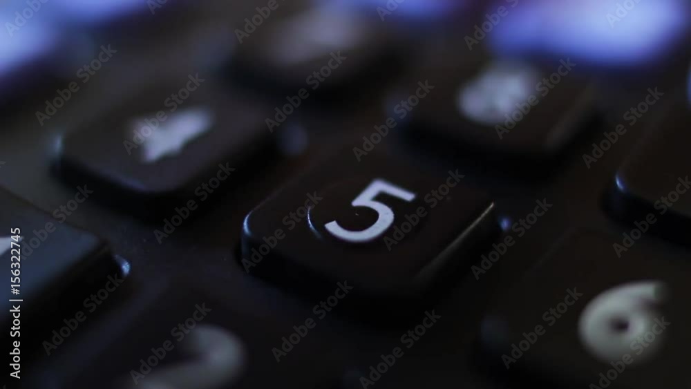 Counting on a calculator. Pressing keys on a calculator by finger. Counting on a calculator. Pressing keys on a calculator by finger.