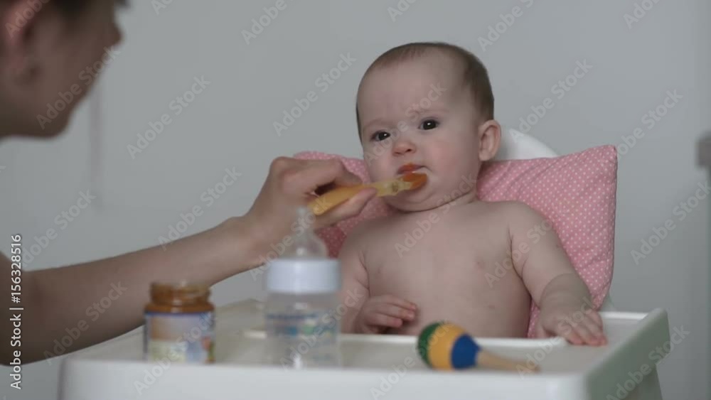 Mom feeds the baby Mom feeds the baby
