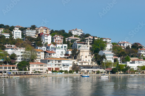 View of Burgazada island from the sea with summer houses and a small mosque. the island is the third largest one of four islands named Princes' Islands in the Sea of Marmara, near Istanbul, Turkey photo