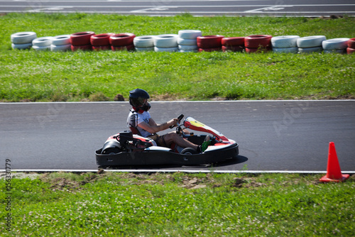young man drive go kart on track © Coka