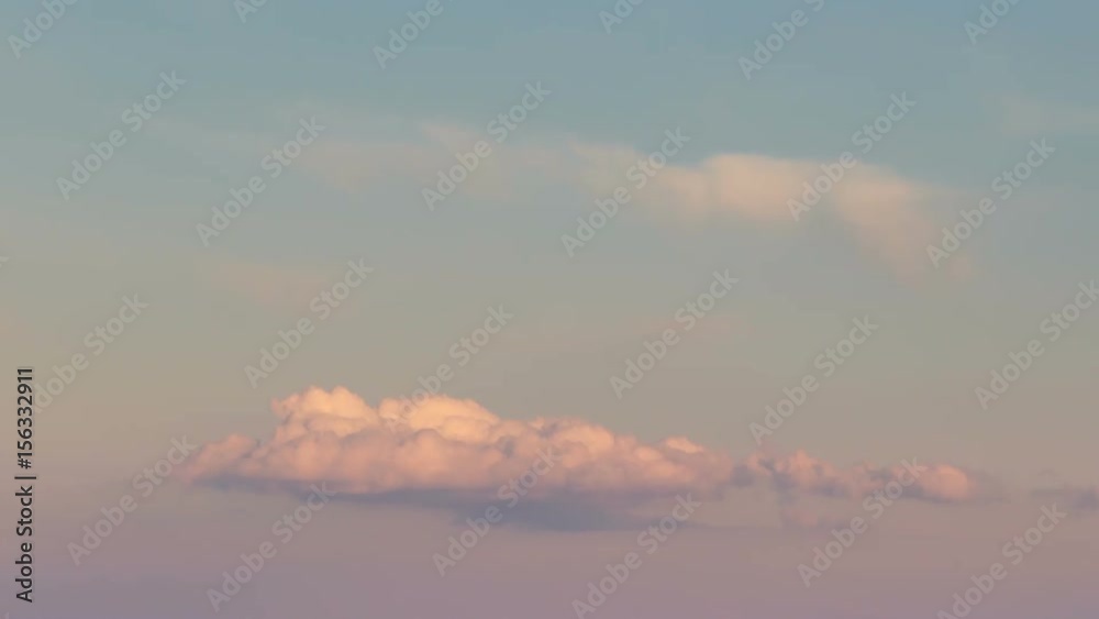 Russia, time lapse. Formation and rapid movement of white clouds of different shapes in the blue sky in late spring at sunset. Russia, time lapse. Formation and rapid movement of white clouds of different shapes in the blue sky in late spring at sunset.