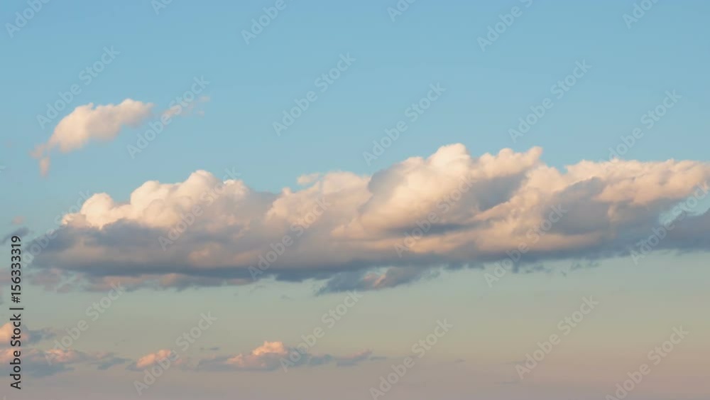 Russia, time lapse. Formation and rapid movement of white clouds of different shapes in the blue sky in late spring at sunset. Russia, time lapse. Formation and rapid movement of white clouds of different shapes in the blue sky in late spring at sunset.