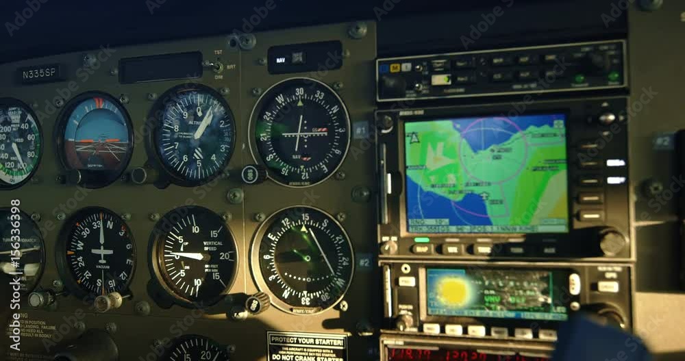 POV cockpit view of small plane instruments and flight controls