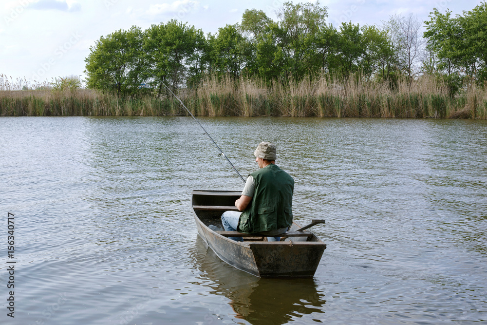 river fishing- man catching fish.