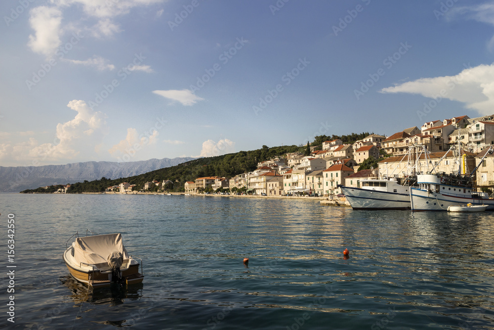 Obraz premium Ships in harbor of fisherman and tourist village Povlja on north east on Island Brac in Croatia