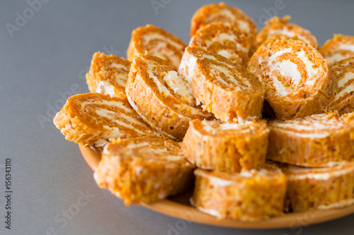 Wallpaper Mural Cutting roll with carrot omelette and ricotta cheese with garlic on orange plate.  Torontodigital.ca